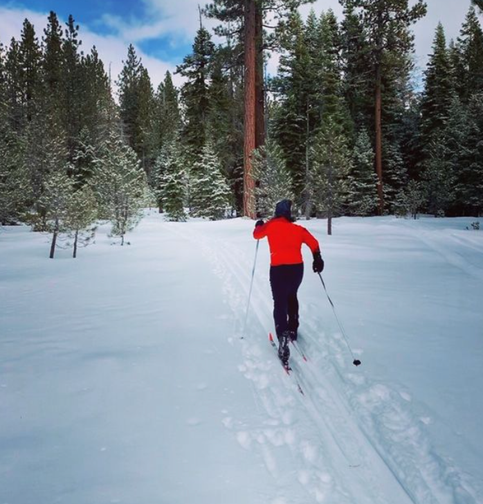 Classic Skier Cutting Trail in Deep Snow
