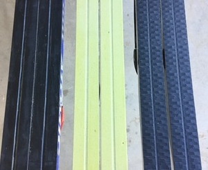Base of three different classic skis.